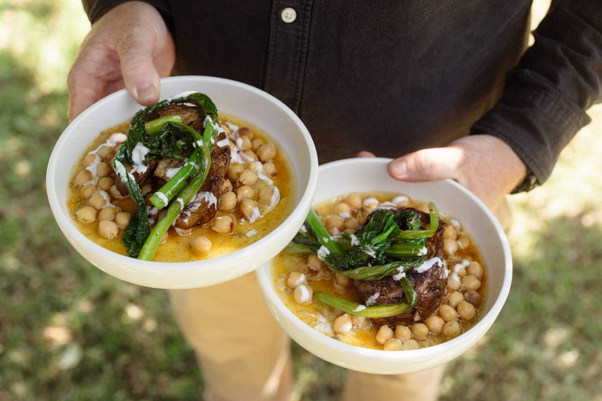 Kilcoy Lamb slow-roasted boneless lamb shoulder, served alongside braised chickpeas and mustard greens